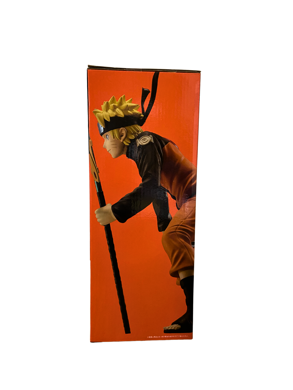 Premio C: Figura de Naruto Uzumaki (Edición con panel de fondo ilustrado por Masashi Kishimoto para la conmemoración de NARUTOP99)